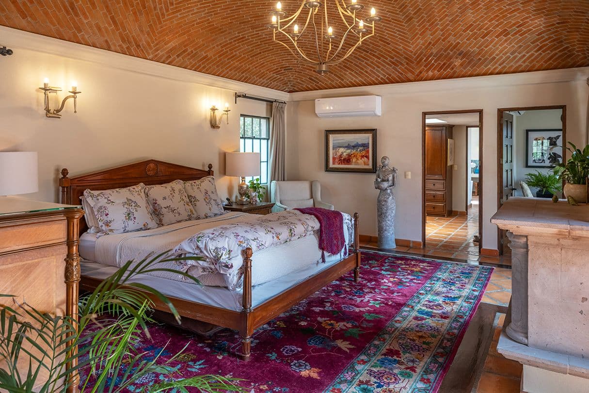 Casa Sol y Luna — Centro, San Miguel de Allende — photo 11 — elegant master suite, soaring brick ceiling