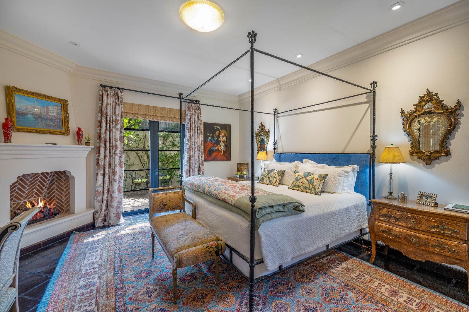 Privada Baeza — Centro, San Miguel de Allende — photo 15 — elegant canopy bedroom, fireplace warmth