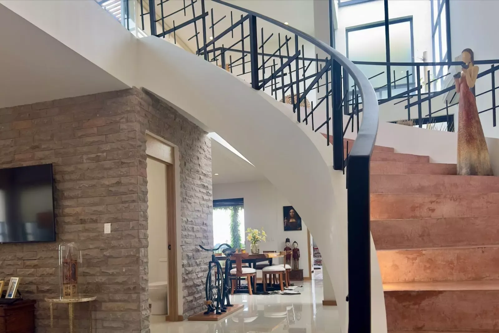 CASA CORDOBA — Residencial Malanquin la Mesa, San Miguel de Allende — photo 11 — contemporary spiral staircase, soaring ceilings