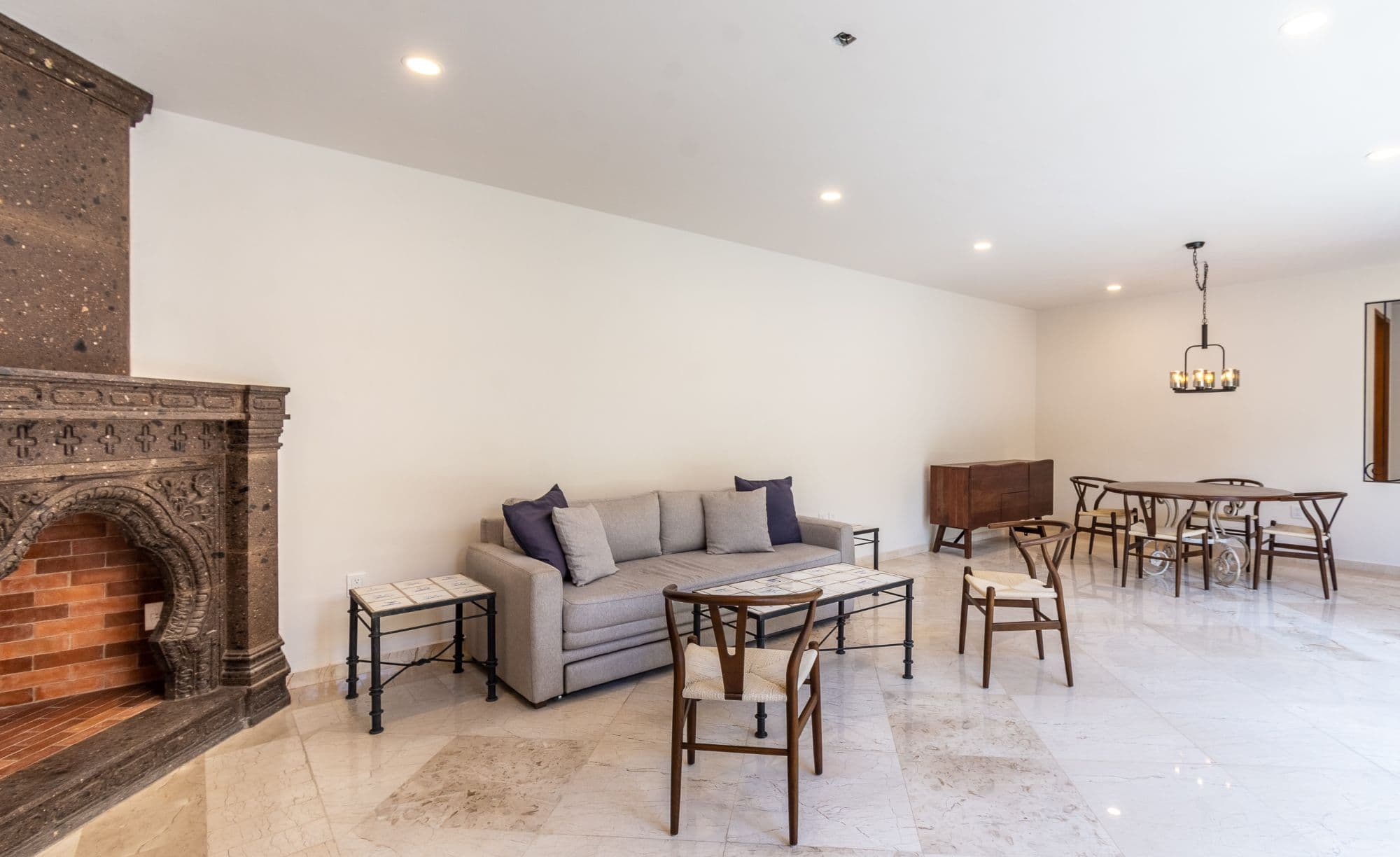 CASA PACO — San Antonio, San Miguel de Allende — photo 8 — elegant open living, historic fireplace charm