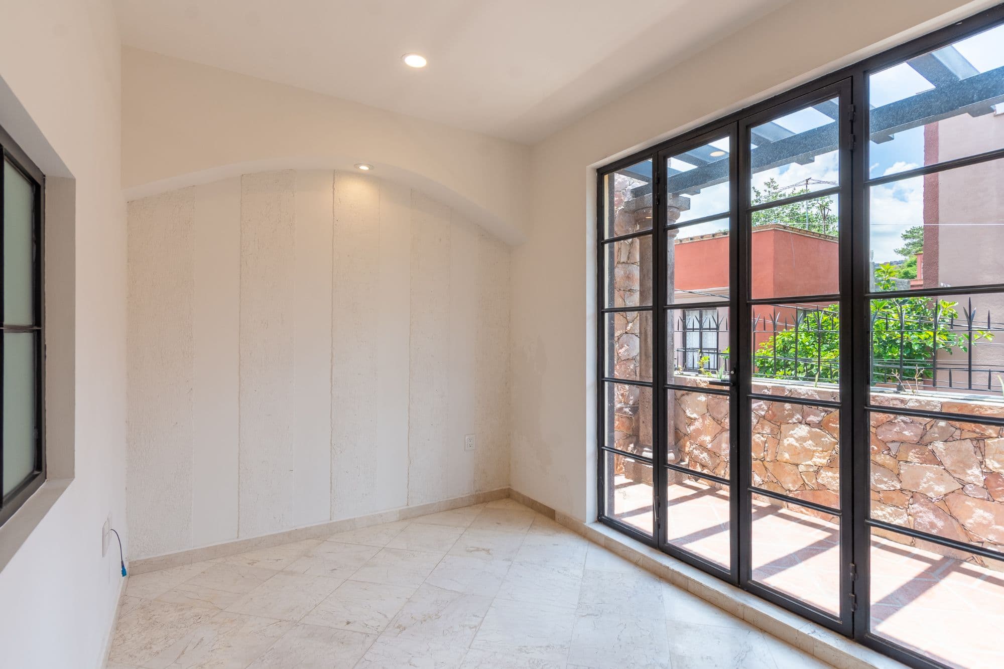 CASA PACO — San Antonio, San Miguel de Allende — photo 12 — sunlit bedroom with terrace views