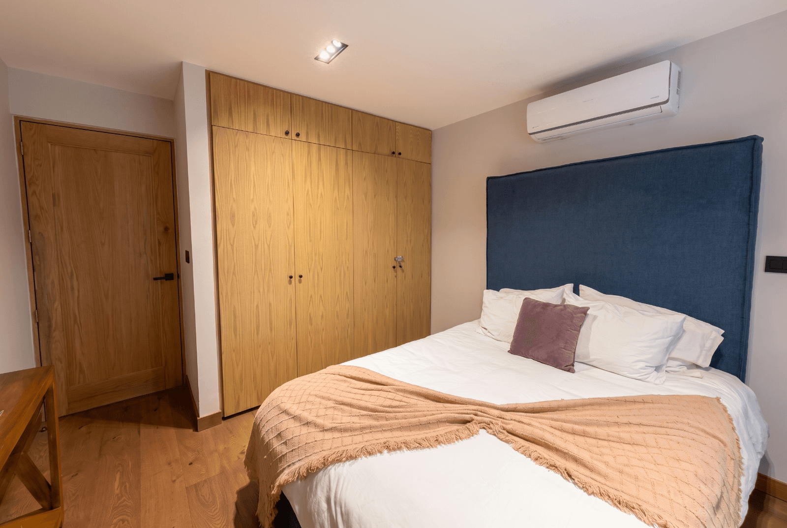 San Antonio 7 - D3 — San Antonio, San Miguel de Allende — photo 7 — serene bedroom with elegant wood cabinetry