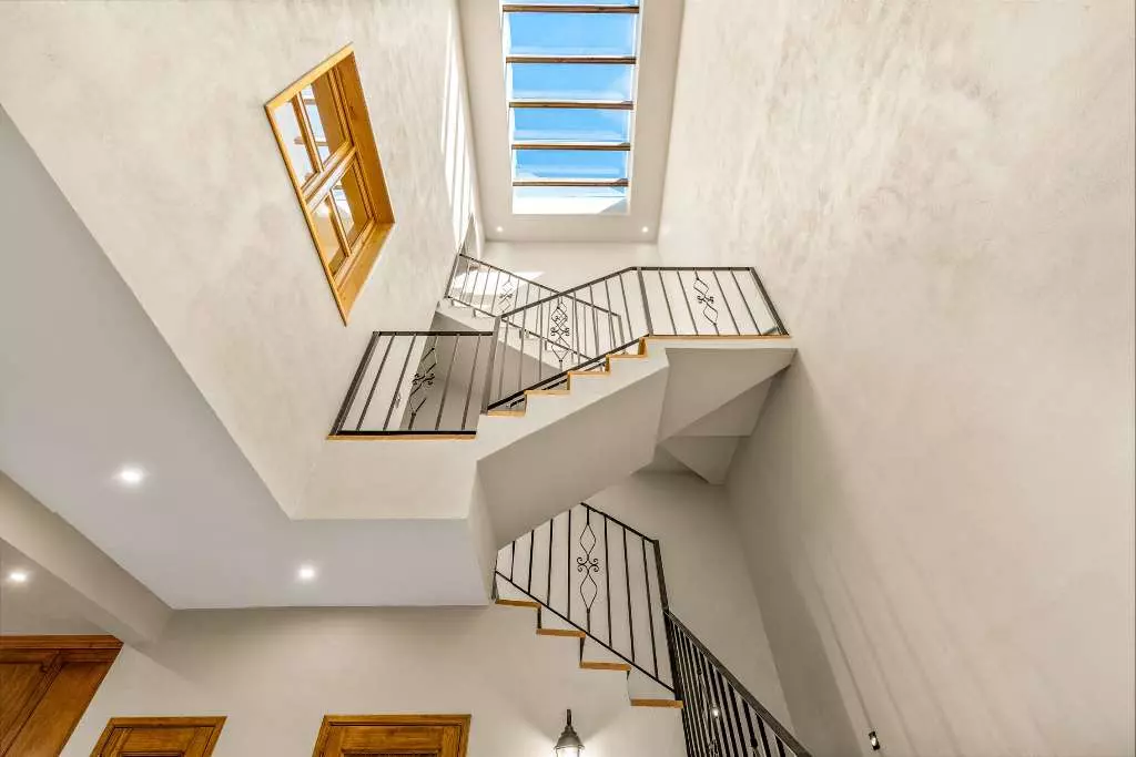 Casa Del Farolito — Guadalupe, San Miguel de Allende — photo 9 — soaring skylight, elegant multi-level staircase