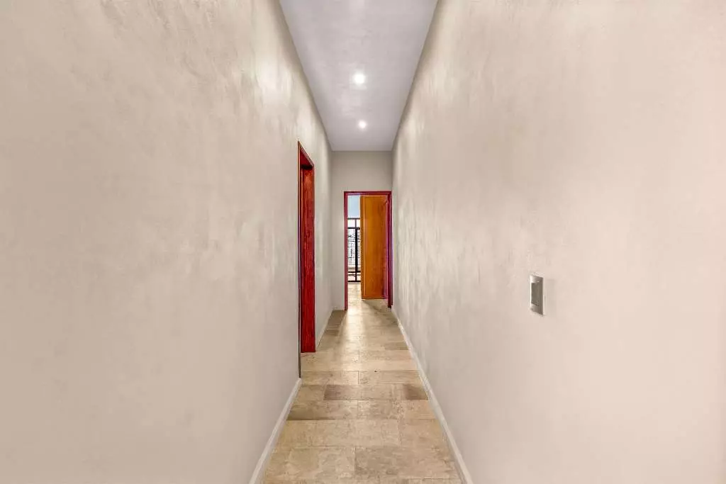 Casa Del Farolito — Guadalupe, San Miguel de Allende — photo 10 — bright hallway, elegant red doors