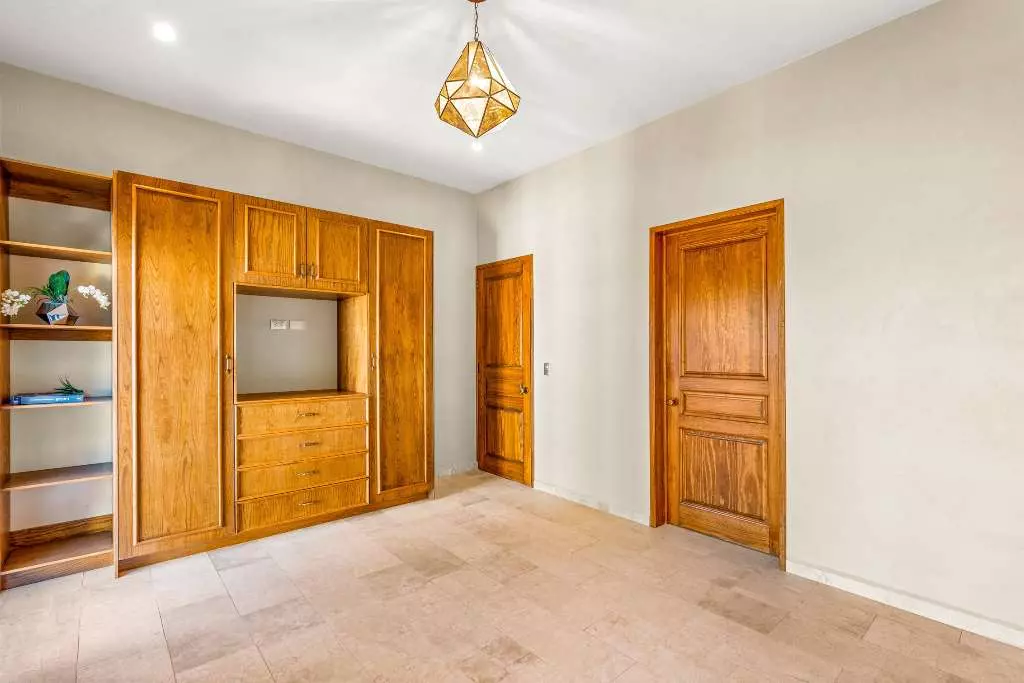 Casa Del Farolito — Guadalupe, San Miguel de Allende — photo 11 — elegant primary suite, architectural woodwork