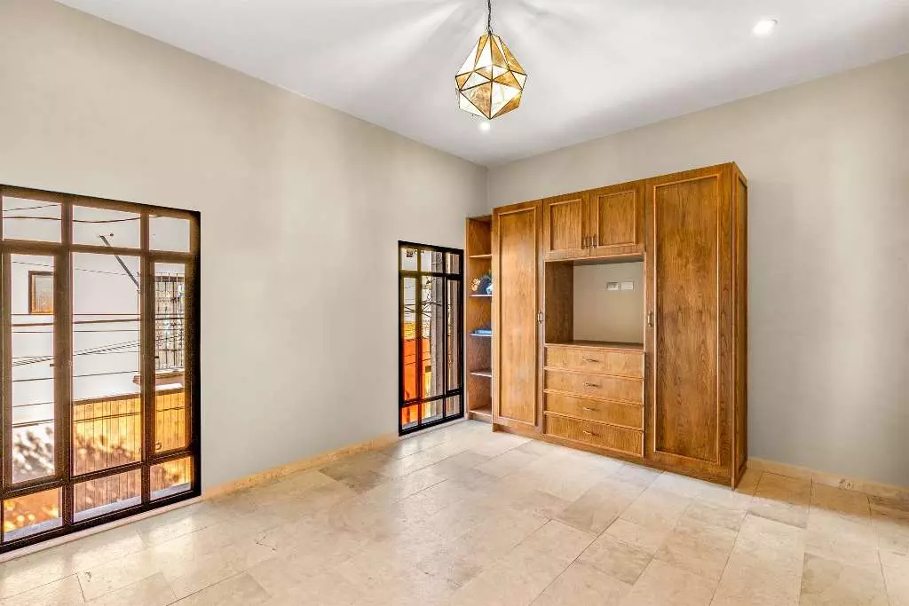 Casa Del Farolito — Guadalupe, San Miguel de Allende — photo 16 — luminous bedroom with rustic wooden charm