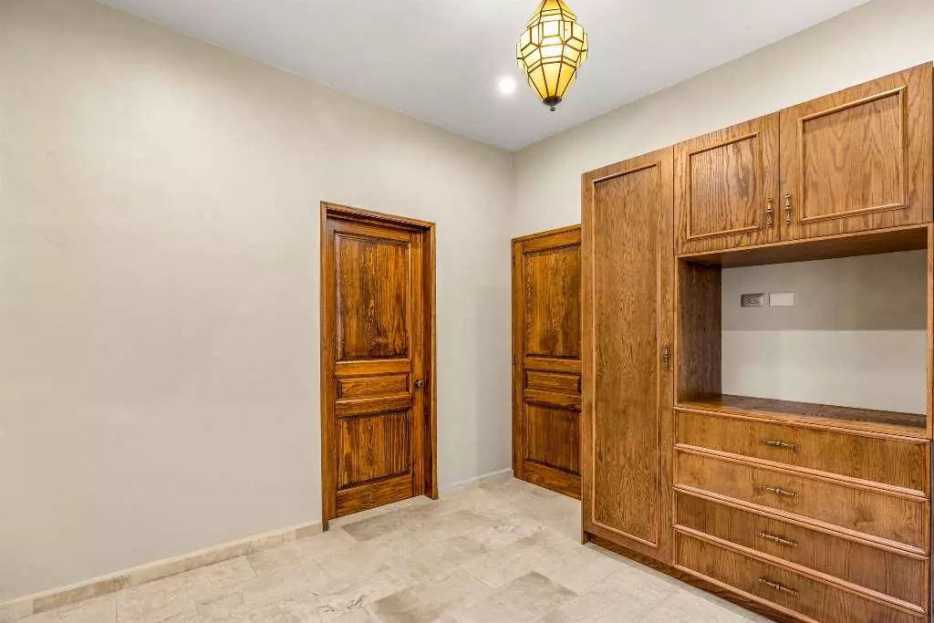 Casa Del Farolito — Guadalupe, San Miguel de Allende — photo 20 — elegant closet with traditional wood craftsmanship