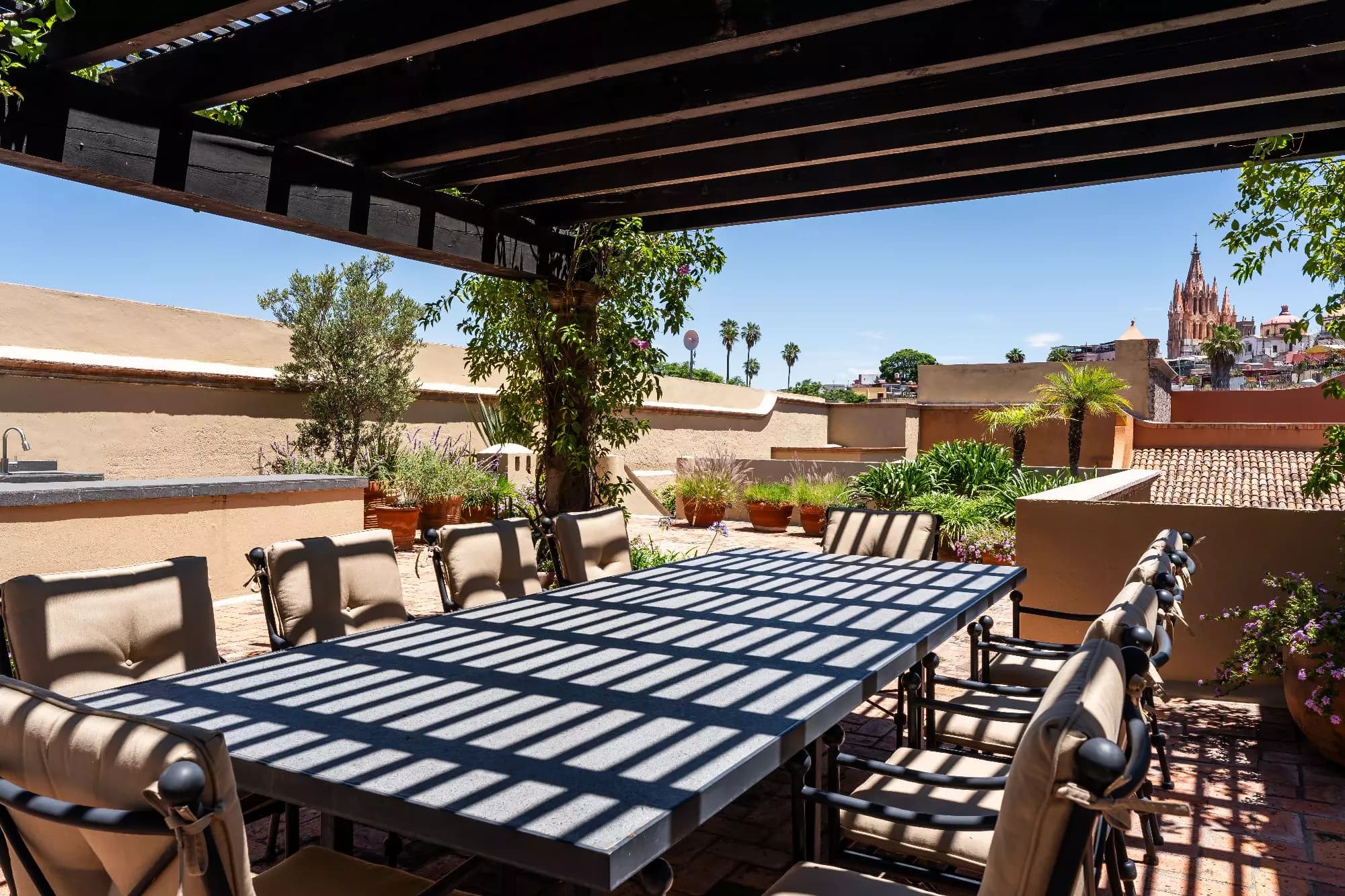 Casa Encantada — Centro, San Miguel de Allende — photo 23 — panoramic rooftop dining with cathedral views