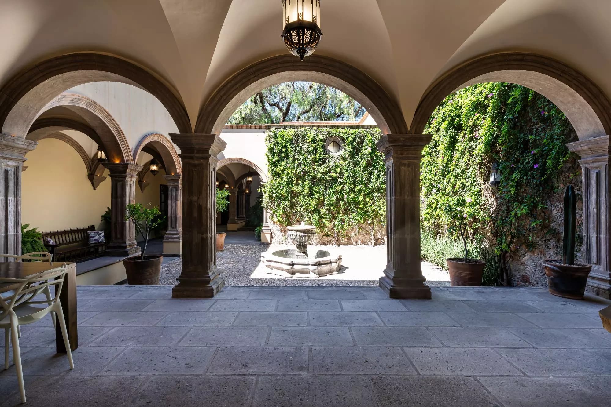 Casa Encantada — Centro, San Miguel de Allende — photo 3 — colonial arches frame verdant courtyard elegance
