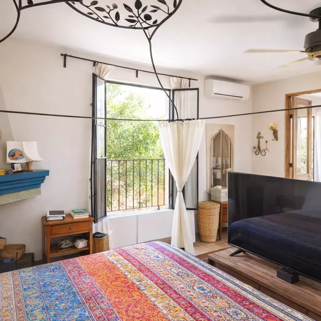 Casa Vergel — San Antonio, San Miguel de Allende — photo 12 — bright bedroom, balcony views, bohemian elegance