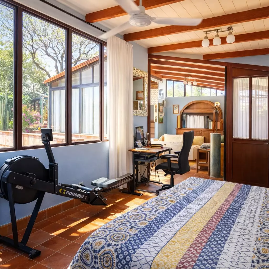 Casa Vergel — San Antonio, San Miguel de Allende — photo 15 — sunlit home gym with architectural charm
