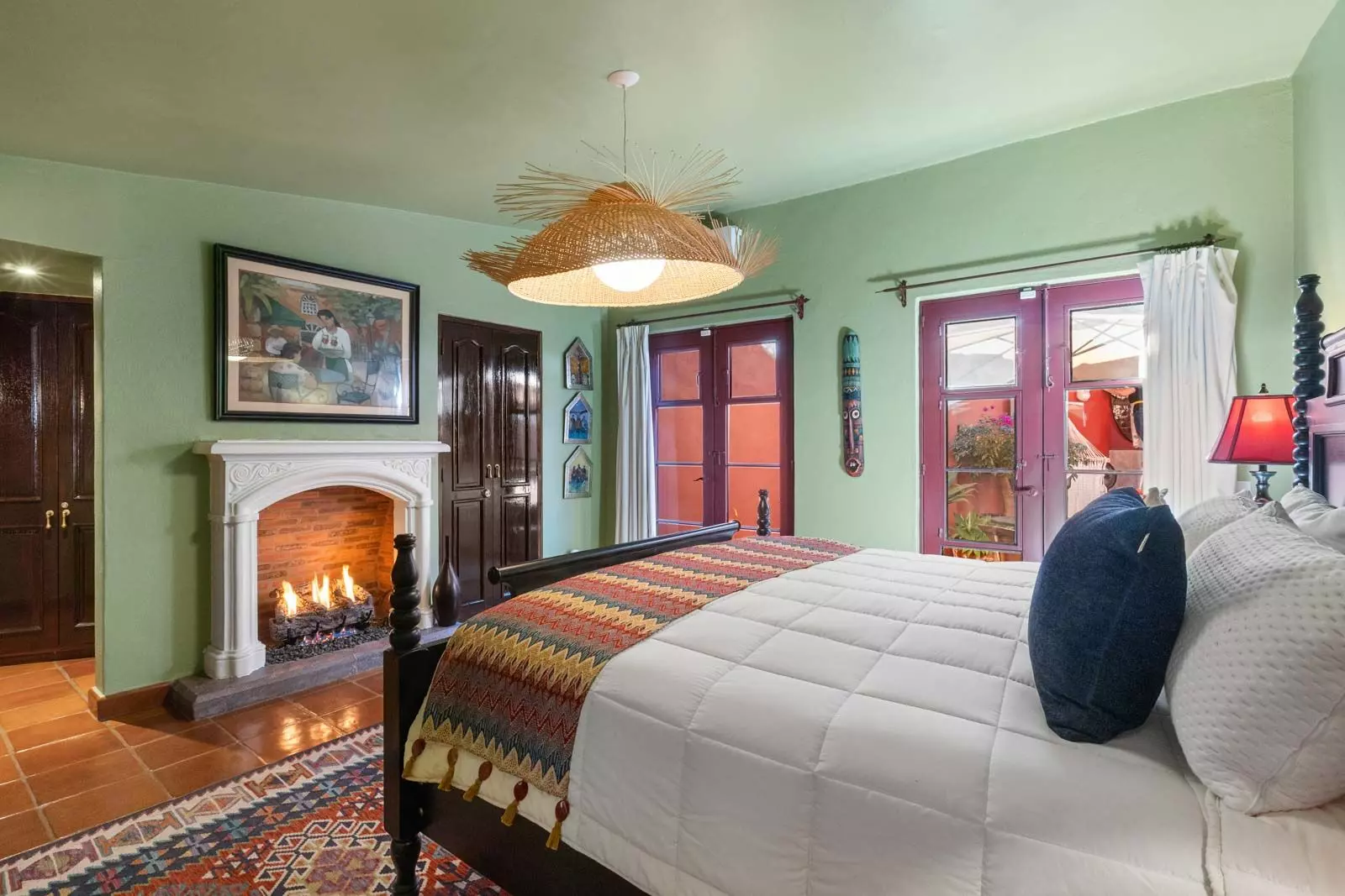 Casa Perro Afortunado — Atascadero (Arcos de San Miguel), San Miguel de Allende — photo 12 — luminous master suite, fireplace warmth, terrace views