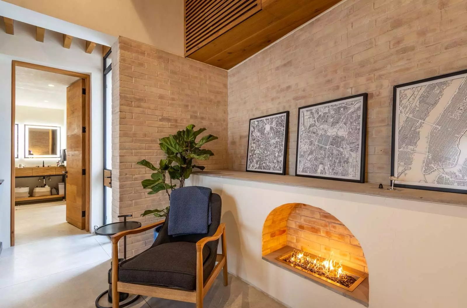 Indigo 8 — Guadiana, San Miguel de Allende — photo 18 — sophisticated fireplace lounge with architectural maps