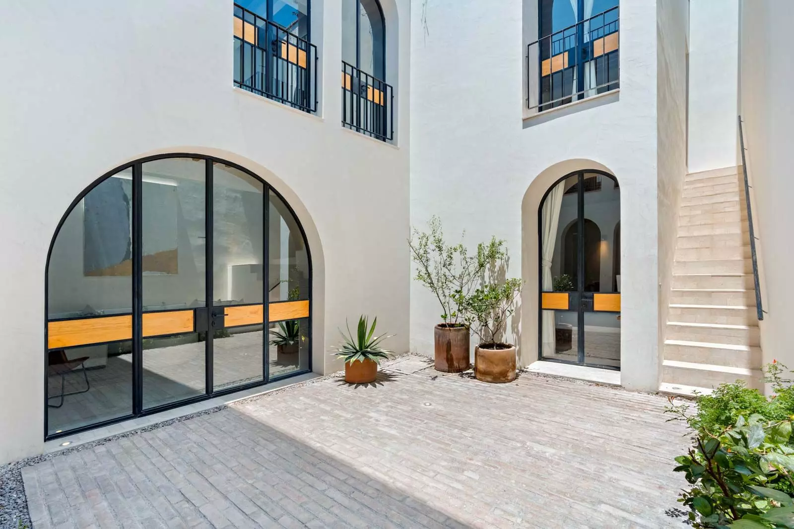 Indigo 8 — Guadiana, San Miguel de Allende — photo 24 — contemporary courtyard with elegant arched doors