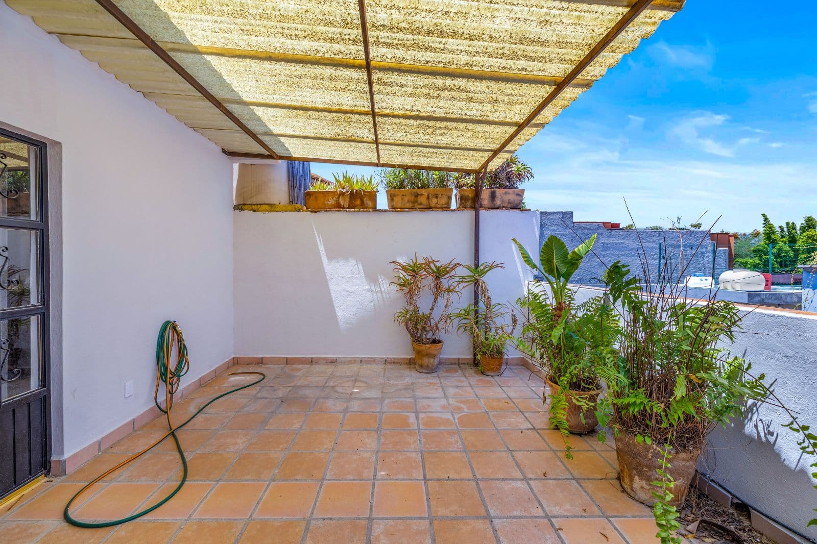 Great Renovation Project — San Antonio, San Miguel de Allende — photo 21 — sunny terracotta terrace, shade pergola