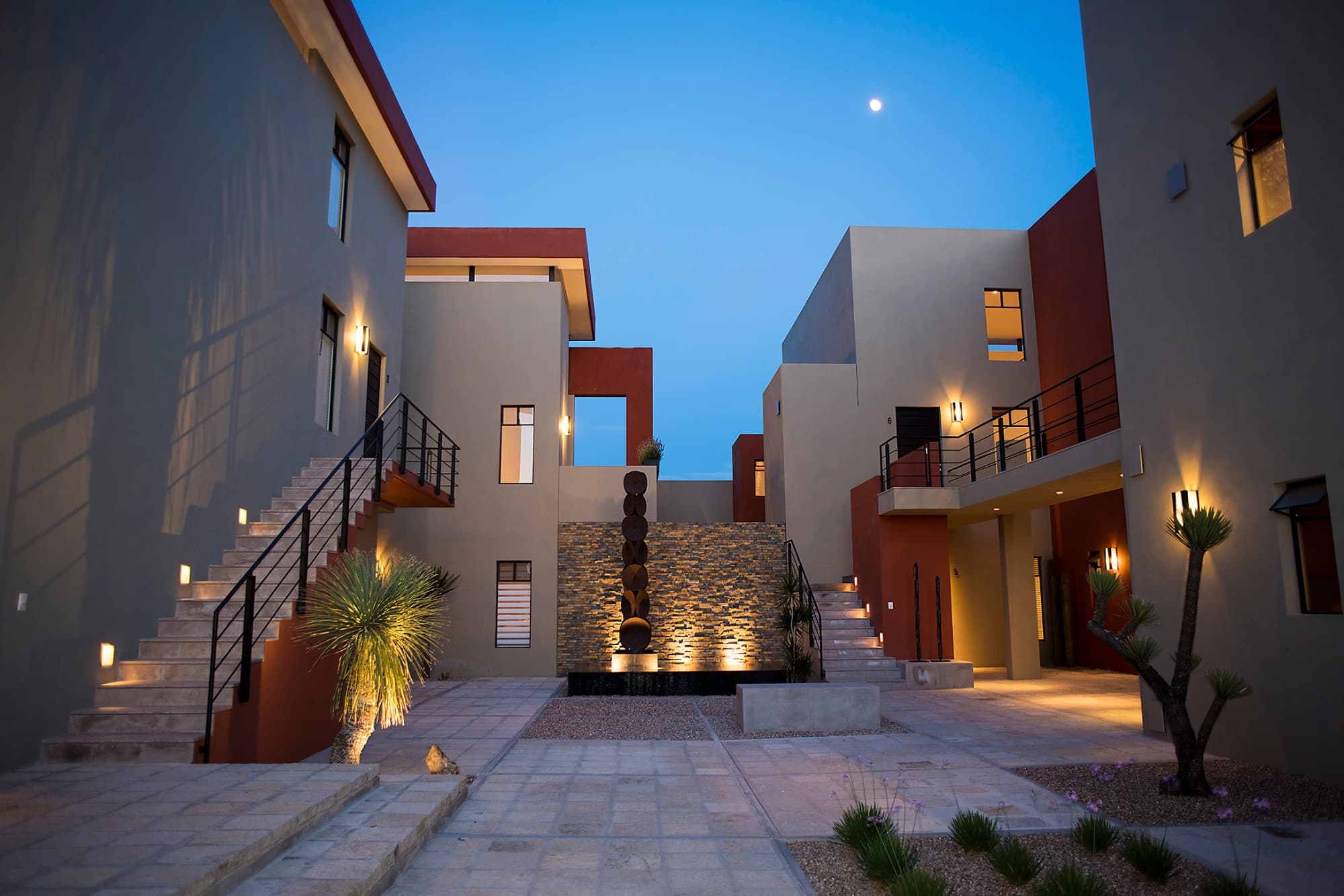 Ground Level Condo — San Antonio, San Miguel de Allende — photo 27 — contemporary courtyard, elegantly illuminated evening