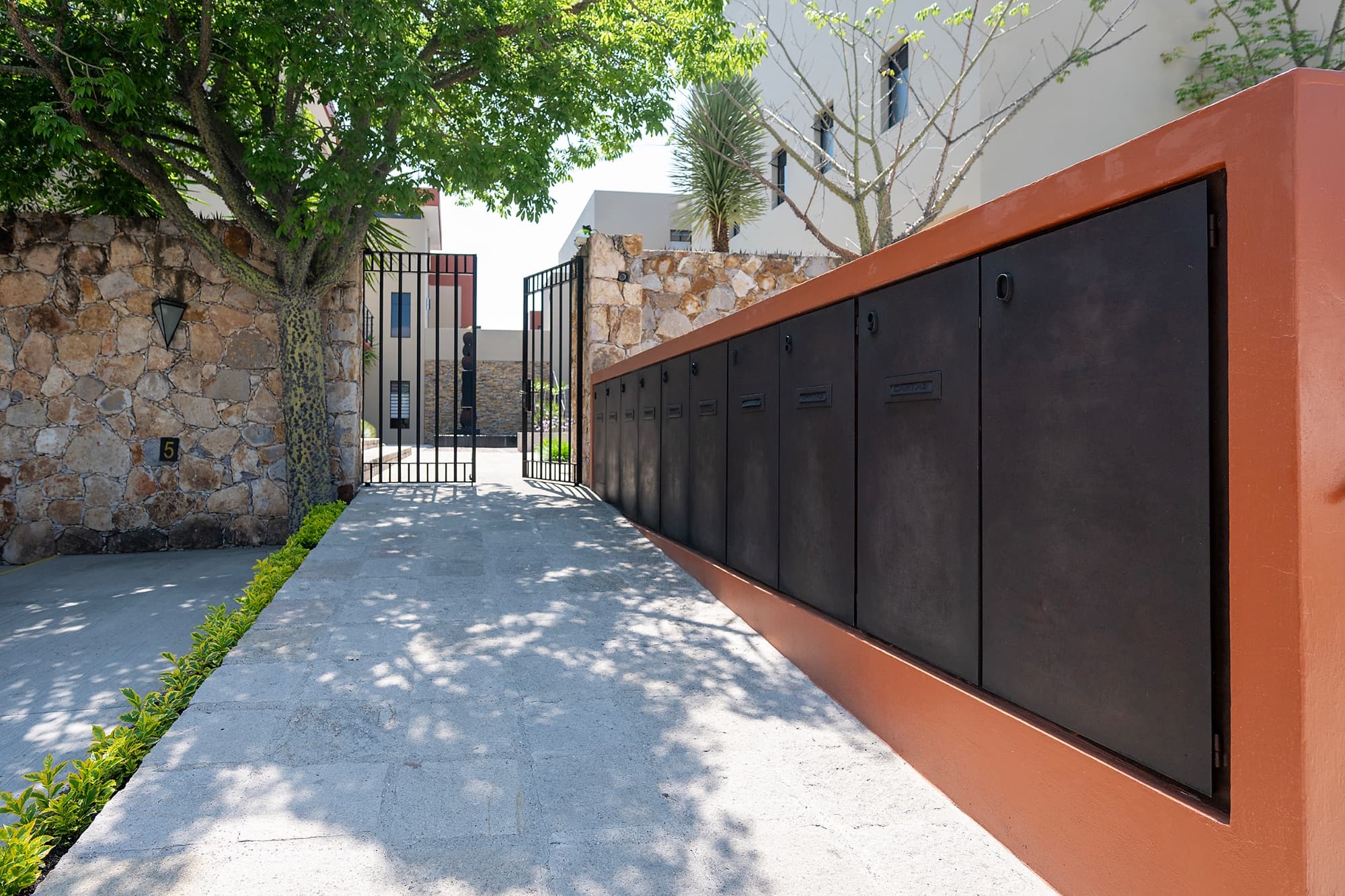 Ground Level Condo — San Antonio, San Miguel de Allende — photo 25 — elegant courtyard with mature shade trees