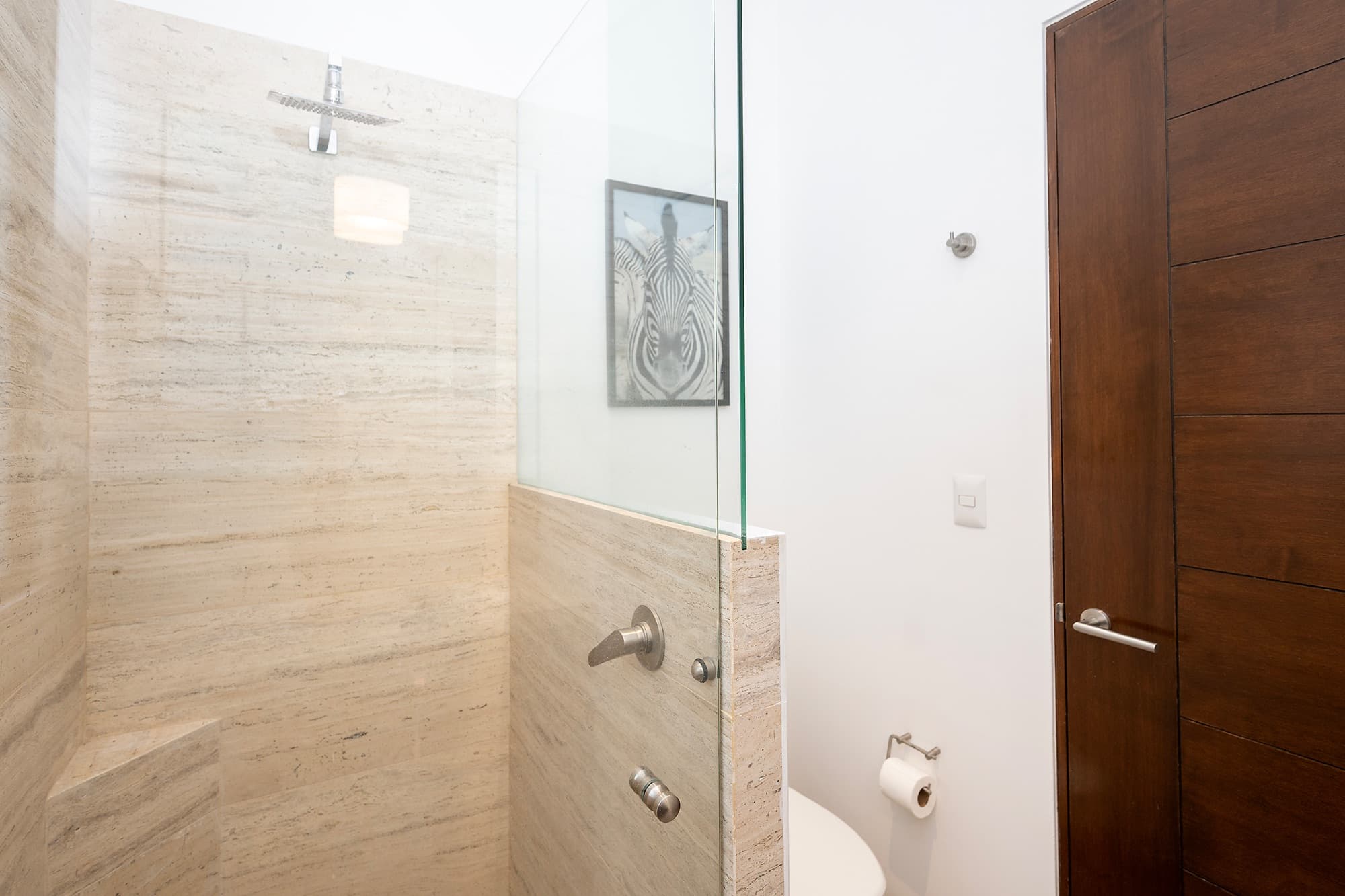 Ground Level Condo — San Antonio, San Miguel de Allende — photo 20 — spa-inspired travertine shower sanctuary